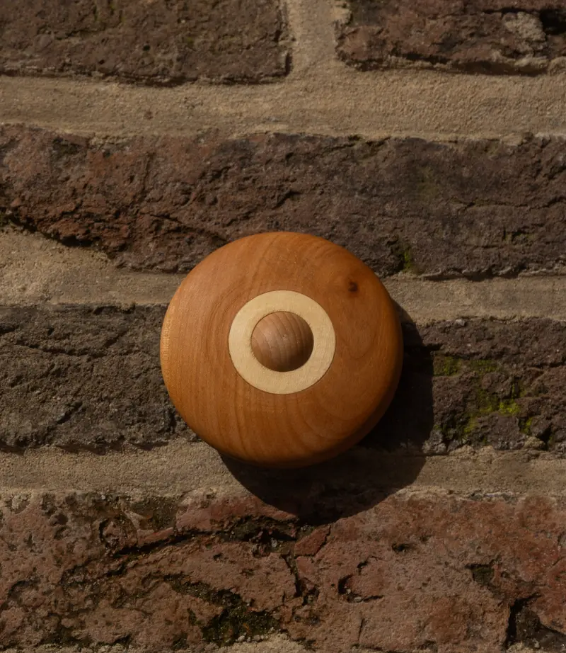 Houten rammelschijf